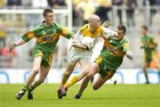 9 July 2006; Sean Burke, Antrim, in action against Leo McLoone, left, and Michael Murphy, Donegal. ESB Ulster Minor Football Championship Final, Donegal v Antrim, Croke Park, Dublin. Picture credit: Pat Murphy / SPORTSFILE