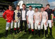 27 June 2014: Jockeys, from left, Gary Carroll, Leigh Roche, Pat Smullen, Wayne Lordan, Billy Lee and Joseph O'Brien with Hector O hEochagain after the Paddy Power Zorb Derby in aid of the Jack and Jill Children's Foundation. Curragh Racecourse, The Curragh, Co. Kildare. Picture credit: Barry Cregg / SPORTSFILE