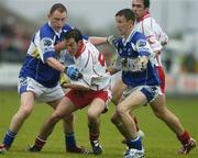 8 July 2006; Davy Harte, Tyrone, in action against Brian McCormack, left, and Gary Kavanagh, Laois. Bank of Ireland All-Ireland Senior Football Championship Qualifier, Round 2, Laois v Tyrone, O'Moore Park, Portlaoise, Co. Laois. Picture credit: Brendan Moran / SPORTSFILE