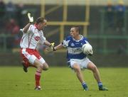 8 July 2006; Ross Munnelly, Laois, in action against Gerard Cavlan, Tyrone. Bank of Ireland All-Ireland Senior Football Championship Qualifier, Round 2, Laois v Tyrone, O'Moore Park, Portlaoise, Co. Laois. Picture credit: Brendan Moran / SPORTSFILE