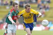 16 July 2006; Paul Garvey, Roscommon, in action against Liam Tunney, Mayo. ESB Connacht Minor Football Championship Final, Mayo v Roscommon, McHale Park, Castlebar, Co. Mayo. Picture credit: Damien Eagers / SPORTSFILE