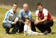 11 July 2006; GAA players, from left, Dessie Dolan, Westmeath, John Mullane, Waterford, and Bryan Cullen, Dublin, with 4 year old Killian Cahill, from Ratoath, Co. Meath, at Elverys Sports Blanchardstown store, for the launch of the PUMA / Elvery Sports GAA Training Day competition. The competition takes place in store at Elverys for the next 4 weeks. Blanchardstown Centre, Blanchardstown, Co. Dublin. Picture credit: Damien Eagers / SPORTSFILE