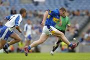 23 July 2006; Tipperary's John Carroll, who droped his hurl, solos, football style, clear of Waterford's Brian Phelan. Guinness All-Ireland Senior Hurling Championship Quarter-Final, Tipperary v Waterford, Croke Park, Dublin. Picture credit: Ray McManus / SPORTSFILE