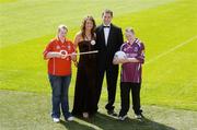 19 July 2006; GAA stars Eimear Brannigan and Darren Magee with Galway supporter Alan Lyons, age 13, and Cork supporter Claire Lyons, age 16, at the announcement of details of the inaugural &quot;Support Your County Ball&quot; in aid of Temple Street Children's Hospital. Sponsored by McNamara and Co. Building Contractors, the ball will take place in the Hogan Suite, Croke Park, on Friday 15th September 2006. Croke Park, Dublin. Picture credit: Brendan Moran / SPORTSFILE