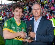 6 July 2014; John Drinan, Senior Customer Relations Manager, Electric Ireland, proud sponsor of the GAA All-Ireland Minor Championships, presents Mark O'Connor from Dingle, Co. Kerry, with the player of the match award for his outstanding performance in the Electric Ireland Munster GAA Football Minor Championship Final, Cork v Kerry, Páirc Ui Chaoimh, Cork. Picture credit: Diarmuid Greene / SPORTSFILE