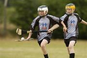 28 July 2006; Cathal O'Toole, age 13, from Carlow Town is tackled by Andrew Beaton, age 12, from Bagenalstown during The Vhi Cul Camps, the official GAA summer camps, got off to a flying start all around the country at the start of July and are now in full swing with up to 75,000 children expected to attend the camps nationwide between July 3rd and 25th August. Bagenalstown, Co. Carlow. Picture credit; Matt Browne / SPORTSFILE
