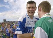 30 July 2006; Laois goalkeeper Fergal Byron with Offaly's Cathal Daly after the match. Bank of Ireland All-Ireland Senior Football Championship Qualifier, Round 4, Laois v Offaly, O'Moore Park, Portlaoise, Co. Laois. Picture credit; Brian Lawless / SPORTSFILE