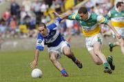 30 July 2006; Aidan Fennelly, Laois, in action against Niall McNamee, Offaly. Bank of Ireland All-Ireland Senior Football Championship Qualifier, Round 4, Laois v Offaly, O'Moore Park, Portlaoise, Co. Laois. Picture credit; Damien Eagers / SPORTSFILE