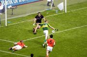 5 August 2006; Kieran Donaghy, Kerry, shoots past the Armagh goalkeeper Paul Hearty to score his side's second goal, Bank of Ireland All-Ireland Senior Football Championship Quarter-Final, Armagh v Kerry, Croke Park, Dublin. Picture credit; Ray McManus / SPORTSFILE