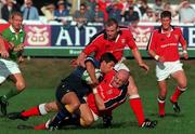 7 August 1999; Barry Everitt of Leinster is tackled by Keith Wood and David Corkery of Munster during the Guinness Interprovincial Rugby Championship match between Munster and Leinster at Temple Hill in Cork. Photo by Matt Browne/Sportsfile