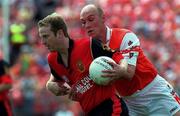 1 August 1999; Ciaran McCabe of Down in action against Gerard Reid of Armagh during the Bank of Ireland Ulster Senior Football Championship Final match between Armagh and Down at St Tiernach's Park at Clones in Monaghan. Photo by David Maher/Sportsfile