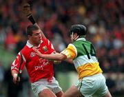 8 August 1999; Diarmuid O'Sullivan of Cork is tackled by Joe Errity of Offaly during the Guinness All-Ireland Hurling Senior Championship Semi-Final match between Cork and Offaly at Croke Park in Dublin. Photo by Brendan Moran/Sportsfile