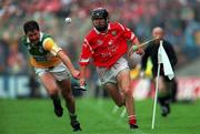 8 August 1999; Martin Hanamy of Offaly in action against  Ben O'Connor of Cork during the Guinness All-Ireland Hurling Senior Championship Semi-Final match between Cork and Offaly at Croke Park in Dublin. Photo by Ray McManus/Sportsfile