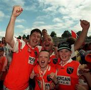 1 August 1999; Armagh's Ger Houlahan, left, celebrates with supporters following the Ulster Senior Football Championship Final match between Armagh and Down at St Tiernach's Park at Clones in Monaghan. Photo by David Maher/Sportsfile
