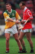 8 August 1999; Diarmuid O'Sullivan of Cork exchanges jerseys with Joe Dooley of Offaly during the Guinness All-Ireland Hurling Senior Championship Semi-Final match between Cork and Offaly at Croke Park in Dublin. Photo by Ray McManus/Sportsfile
