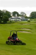 12 July 2006; A greenkeeper attending to one of the fairways on the Palmer Course at the K Club. K Club, Straffan, Co. Kildare. Picture credit: Brendan Moran / SPORTSFILE