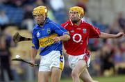 9 August 2006; James Woodlock, Tipperary, in action against Cathal Naughton, Cork. Erin U21 Munster Hurling Final, Tipperary v Cork, Semple Stadium, Thurles, Co. Tipperary. Picture credit; Damien Eagers / SPORTSFILE