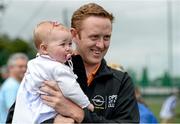 12 July 2014; Opel Kit for Clubs Ambassador Colm Cooper, Kerry, with Emily Cramer-O'Meara, aged 9 months, from Knocklyon, Dublin, at the Ballyboden St. Endas GAA Opel Kit for Clubs Blitz Day. For every test drive, car service or Opel purchase made through the Opel dealer network, your local GAA club is awarded points. Build up your points and redeem them against high quality kit for your club! Log onto opelkitforclubs.com and support  your local GAA club!Ballyboden St. Endas GAA Opel Kit for Clubs Blitz Day, Sancta Maria College Grounds, Rathfarnham, Dublin. Picture credit: Barry Cregg / SPORTSFILE