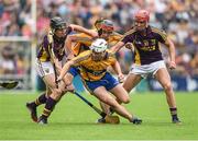 12 July 2014; Clare's Patrick O'Connor, with support from team-mate Jack Browne, under pressure from Wexford's Liam Og McGovern, left, and Paul Morris. GAA Hurling All-Ireland Senior Championship Round 1 Replay, Clare v Wexford, Wexford Park, Wexford. Picture credit: Ray McManus / SPORTSFILE