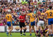12 July 2014; Clare's Brendan Bugler is shown a straight red card by referee Johnny Ryan. GAA Hurling All-Ireland Senior Championship Round 1 Replay, Clare v Wexford, Wexford Park, Wexford. Picture credit: Ray McManus / SPORTSFILE