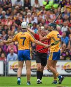 12 July 2014; Patrick O'Connor, left, and Brendan Bugler, Clare, react after Bugler is sent off by referee Johnny Ryan. GAA Hurling All-Ireland Senior Championship Round 1 Replay, Clare v Wexford, Wexford Park, Wexford. Picture credit: Ray McManus / SPORTSFILE