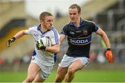 12 July 2014; Ross Munnelly, Laois, in action against Hugh Coghlan, Tipperary. GAA Football All-Ireland Senior Championship Round 3A, Laois v Tipperary. O'Moore Park, Portlaoise, Co. Laois. Picture credit: Piaras Ó Mídheach / SPORTSFILE