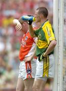 5 August 2006; Kieran Donaghy, Kerry, takes a drink of water as Armagh full-back Francie Bellew wipes the sweat from his brow. Bank of Ireland All-Ireland Senior Football Championship Quarter-Final, Armagh v Kerry, Croke Park, Dublin. Picture credit; Damien Eagers / SPORTSFILE