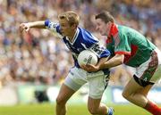 13 August 2006; Ross Munnelly, Laois, in action against Peadar Gardiner, Mayo. Bank of Ireland All-Ireland Senior Football Championship Quarter-Final, Mayo v Laois, Croke Park, Dublin. Picture credit; Matt Browne  / SPORTSFILE