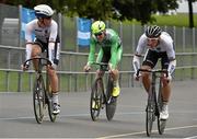 12 July 2014; Martyn Irvine, Ireland, comes to the finishline in third place behind Maximilian Beyer, left, Germany, and Lucas Liss, Germany, and is eliminated in the Mens Omnium 4k Pursuit race during the UCI Track Cycling International Grand Prix, Velodrome, Eamonn Ceant Park, Kimmage, Dublin. Picture credit: Barry Cregg / SPORTSFILE