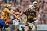 12 July 2014; Ciarán Kenny, Wexford, in action against Conor McGrath, Clare. GAA Hurling All-Ireland Senior Championship Round 1 Replay, Clare v Wexford, Wexford Park, Wexford. Picture credit: Dáire Brennan / SPORTSFILE