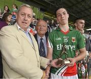 13 July 2014; Kevin Molloy, left, from Electric Ireland, proud sponsor of the GAA All-Ireland Minor Championships, presents Mayo's Brian Reape, with the player of the match award for his outstanding performance in the Connacht GAA Football Minor Championship final, also in picture is former GAA President Dr.Mick Loftus. Electric Ireland Man of the Match at Connacht GAA Football Minor Championship Final, Mayo v Roscommon, Elverys MacHale Park, Castlebar, Co. Mayo. Picture credit: David Maher / SPORTSFILE