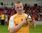 13 July 2014; Electric Ireland, proud sponsor of the GAA All-Ireland Minor Championships, presents Eoin Conlon from Antrim with the player of the match award for his outstanding performance in the Ulster GAA Hurling Minor Championship Final. Electric Ireland Man of the Match at Ulster GAA Hurling Minor Championship Final, Antrim v Derry, Owenbeg, Derry. Picture credit: Oliver McVeigh / SPORTSFILE