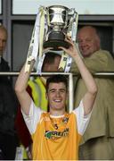 13 July 2014; Electric Ireland, proud sponsor of the GAA All-Ireland Minor Championships, sees Ryan McNulty , Antrim Captain with the Ulster GAA Hurling Minor Championship trophy. Electric Ireland Ulster GAA Hurling Minor Championship Final, Antrim v Derry, Owenbeg, Derry. Picture credit: Oliver McVeigh / SPORTSFILE