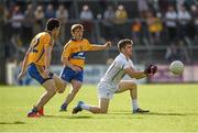19 July 2014; Niall Kelly, Kildare, in action against Shane Brennan, left, and Pádraic Collins, Clare. GAA Football All Ireland Senior Championship, Round 3B, Clare v Kildare, Cusack Park, Ennis, Co. Clare. Picture credit: Diarmuid Greene / SPORTSFILE