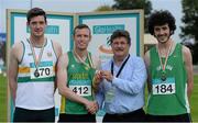 19 July 2014; John Foley, CEO, Athletics Ireland, presents the gold medal for the Men's Triple Jump to Denis Finnegan, An Riocht AC, Kerry, in the company of silver medallist Eoin Kelly, left, St Abban's AC, Laois and bronze medallist Sean Archer, Ferrybank AC, Waterford. GloHealth Senior Track and Field Championships, Morton Stadium, Santry, Co. Dublin. Picture credit: Brendan Moran / SPORTSFILE