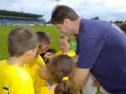 23 August 2006; Former Republic of Ireland international Niall Quinn signs autographs during the Dublin Docklands Festival of Hurling and Gaelic Football, which is sponsored by the Dublin Docklands Development Authority. Parnell Park, Dublin. Picture credit: Pat Murphy / SPORTSFILE