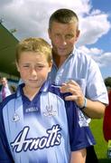 24 August 2006; Dublin football Manager Paul Caffrey signs the jersey of Ciaran Stafford, age 11, from Irishtown. Paul was on hand today to present children from the Docklands with certificates for participating in the Docklands Festival of Hurling and Gaelic Football. Parnell Park, Dublin. Picture credit; Brian Lawless / SPORTSFILE
