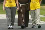 27 August 2006; Joan McNevin, right and Paddy Pender with Br. Kevin Crowley at the final training session before they head for the highways to walk from Monaghan to Dublin. The aim of the walk is to raise awareness about the issue of homelessness and they will be relying on the public to offer food, water and shelter, the girls will be homeless for the duration of their walk. Please take care driving between Monaghan, Castleblayney, Carrickmacross, Ardee, Navan, Clonee and Dublin between the 2nd of September and 6th September. The Capuchin Day Centre, run by the Irish Franciscan Capuchins, provides hot meals for up to 300 people a day. Picture credit; Damien Eagers / SPORTSFILE