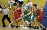 26 August 2006; Kate Maher, Ireland, in action against Debora Esceorcio, 12, and Sara Felipe, 11, Portugal. Women's Senior International Basketball Friendly, Ireland v Portugal, National Basketball Arena, Tallaght, Dublin. Picture credit; Brendan Moran / SPORTSFILE