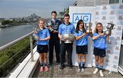 24 July 2014; Representatives of Dublin’s recent Leinster Championship winning football teams paid a visit to the offices of Dublin GAA sponsor AIG today to celebrate their success. Dublin teams at minor, Under-21 and senior level in both male and female codes have secured provincial honours already this summer with the Under-21 sides both going on to win All Ireland titles. Players in attendance were, from left, Martha Byrne, U-21 Ladies Footballer, Lorcan Molloy, U-21 Footballer, Paddy Andrews Senior Footballer, Lyndsey Davey, Ladies Senior Footballer, and Aoife Curran, Ladies Minor Footballer, who were all on hand for the event with the silverware they have won. AIG has also launched exclusive car, home and travel insurance rates for GAA club members at www.aig.ie/dubs. Picture credit: Brendan Moran / SPORTSFILE