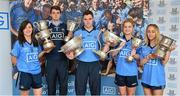 24 July 2014; Representatives of Dublin’s recent Leinster Championship winning football teams paid a visit to the offices of Dublin GAA sponsor AIG today to celebrate their success. Dublin teams at minor, Under-21 and senior level in both male and female codes have secured provincial honours already this summer with the Under-21 sides both going on to win All Ireland titles. Players in attendance were, from left, Lyndsey Davey, Ladies Senior Footballer, Lorcan Molloy, U-21 Footballer, Paddy Andrews Senior Footballer, Martha Byrne, U-21 Ladies Footballer, and Aoife Curran, Ladies Minor Footballer, who were all on hand for the event with the silverware they have won. AIG has also launched exclusive car, home and travel insurance rates for GAA club members at www.aig.ie/dubs. Picture credit: Brendan Moran / SPORTSFILE