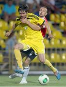 24 July 2014; Aleksei Yanushkevich, Shakhtyor Soligorsk, in action against Nathan Boyle, Derry City. UEFA Champions League, Second Qualifying Round, Second Leg, Shakhtyor Soligorsk v Derry City, Stroitel Stadium, Soligorsk, Belarus. Picture credit: Tatiana Zenkovich / SPORTSFILE