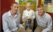 4 September 2006; Kilkenny's senior hurlers James Ryall, left, and Richie Power with patient Wade Lambert and the Liam MacCarthy Cup on the team's visit to our Our Lady's Hospital For Sick Children, Crumlin, Dublin. Picture credit: Damien Eagers / SPORTSFILE