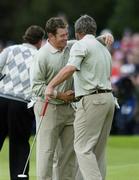 22 September 2006; Lee Westwood and Darren Clarke, Team Europe 2006, congratulate each other after defeating Mickelson / DiMarco during Friday morning's four-ball matches. 36th Ryder Cup Matches, K Club, Straffan, Co. Kildare, Ireland. Picture credit: Brendan Moran / SPORTSFILE