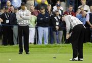 22 September 2006; Jim Furyk, Team USA 2006, putts on the 11th green, watched by team-mate Tiger Woods during Friday morning's four-ball matches. 36th Ryder Cup Matches, K Club, Straffan, Co. Kildare, Ireland. Picture credit: Brendan Moran / SPORTSFILE