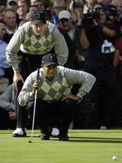 22 September 2006; Tiger Woods, Team USA 2006, checks his line with the help of team-mate Jim Furyk, during Friday morning's four-ball matches. 36th Ryder Cup Matches, K Club, Straffan, Co. Kildare, Ireland. Picture credit: Brendan Moran / SPORTSFILE