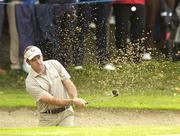 22 September 2006; Paul McGinley, Team Europe 2006, plays from the bunker at the 11th hole during Friday afternoon's foursomes matches. 36th Ryder Cup Matches, K Club, Straffan, Co. Kildare, Ireland. Picture credit: Matt Browne / SPORTSFILE
