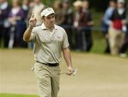 22 September 2006; Paul McGinley, Team Europe 2006, acknowledges the crowd after playing from the bunker on the 12th hole during Friday afternoon's foursomes matches. 36th Ryder Cup Matches, K Club, Straffan, Co. Kildare, Ireland. Picture credit: Matt Browne / SPORTSFILE