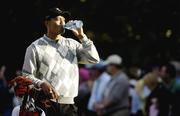 22 September 2006; Tiger Woods, Team USA 2006, takes a drink on the 16th fairway during the afternoon's four-somes matches. 36th Ryder Cup Matches, K Club, Straffan, Co. Kildare, Ireland. Picture credit: Brendan Moran / SPORTSFILE