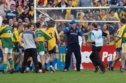 23 September 2006; The Roscommon minor manager Fergal O'Donnell tries to stop the fighting between his players and Kerry. ESB All-Ireland Minor Football Championship Final Replay, Kerry v Roscommon, Cusack Park, Ennis, Co. Clare. Picture credit: Ray Ryan / SPORTSFILE
